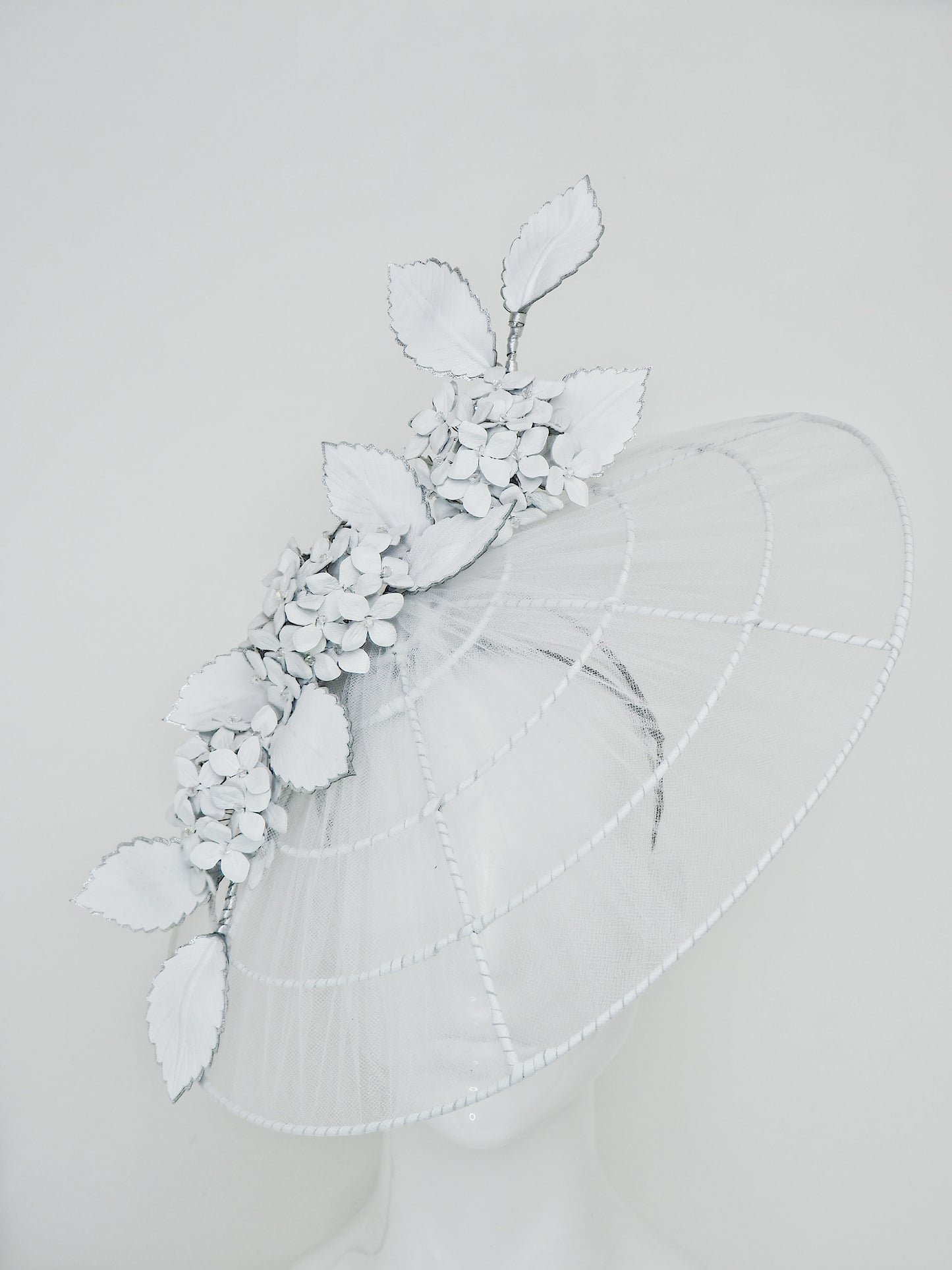 Just a Whisper - White tulle and leather brim with Hydrangeas