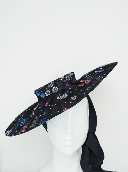 Magic Dust - Tulle wire brimmed boater with petersham ties and glitter printed flowers.